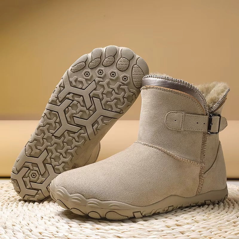 Gevoerde laarzen in zandbeige met zicht op de antislip barefoot-zool