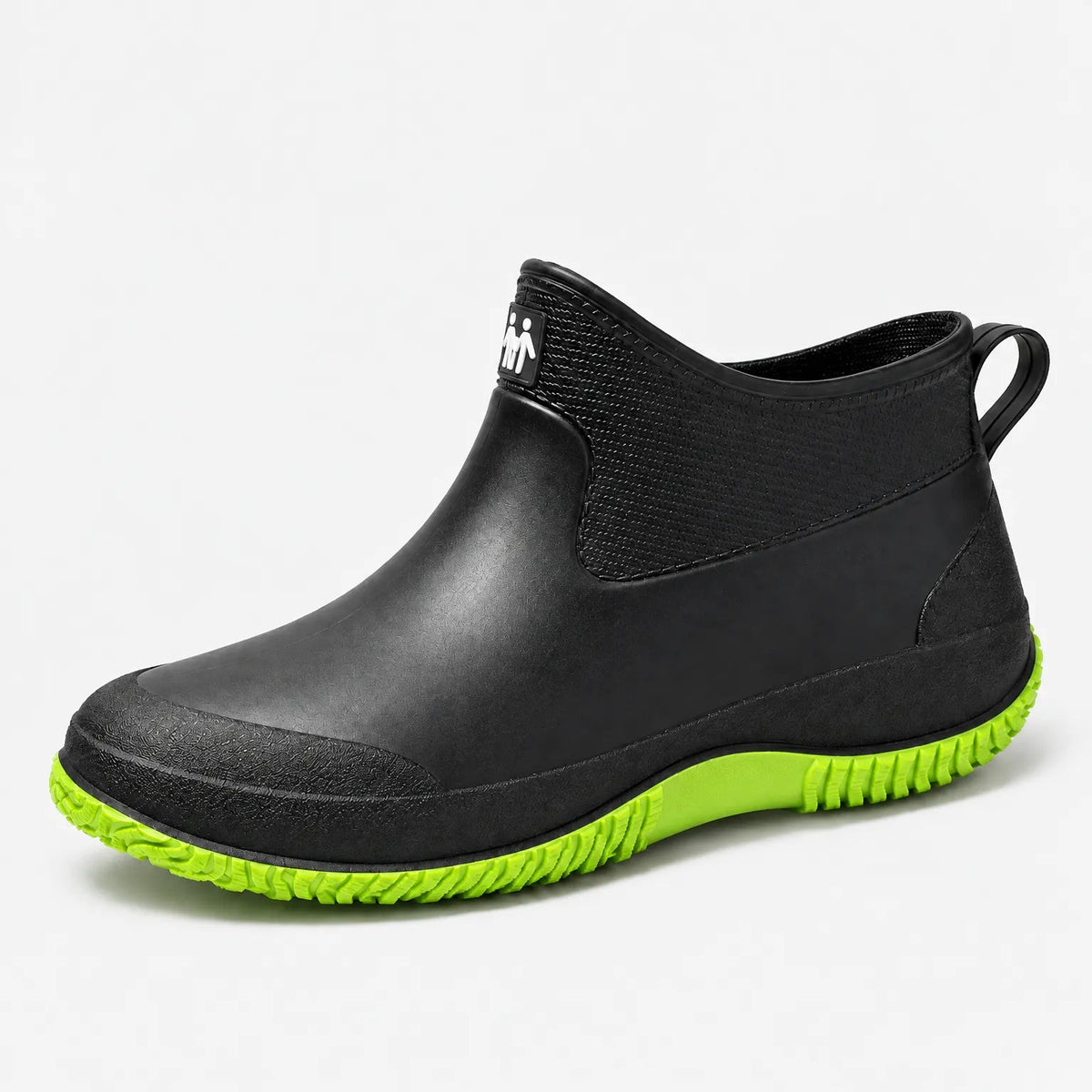 Korte regenlaarzen dames in zwart met groene zool – productfoto