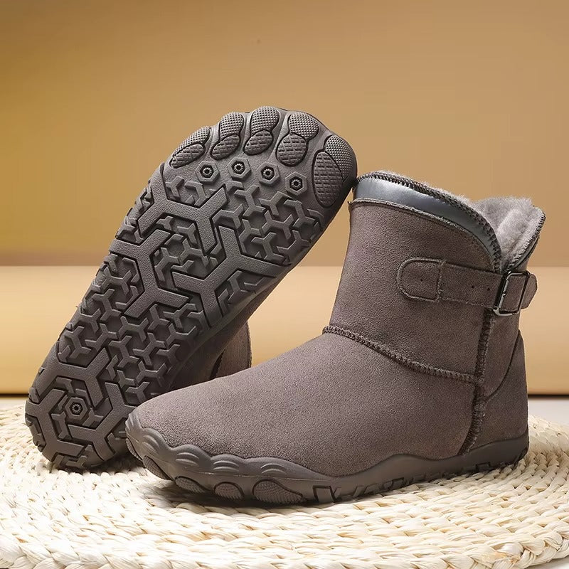 Gevoerde laarzen in taupe met zicht op de antislip barefoot-zool