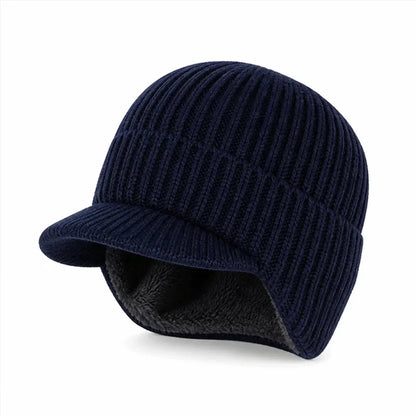 Muts met oorflappen in marineblauw – gebreide muts met klep, donkere fleecevoering zichtbaar