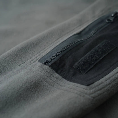 Fleece trui heren – close-up van de ritszak op de mouw