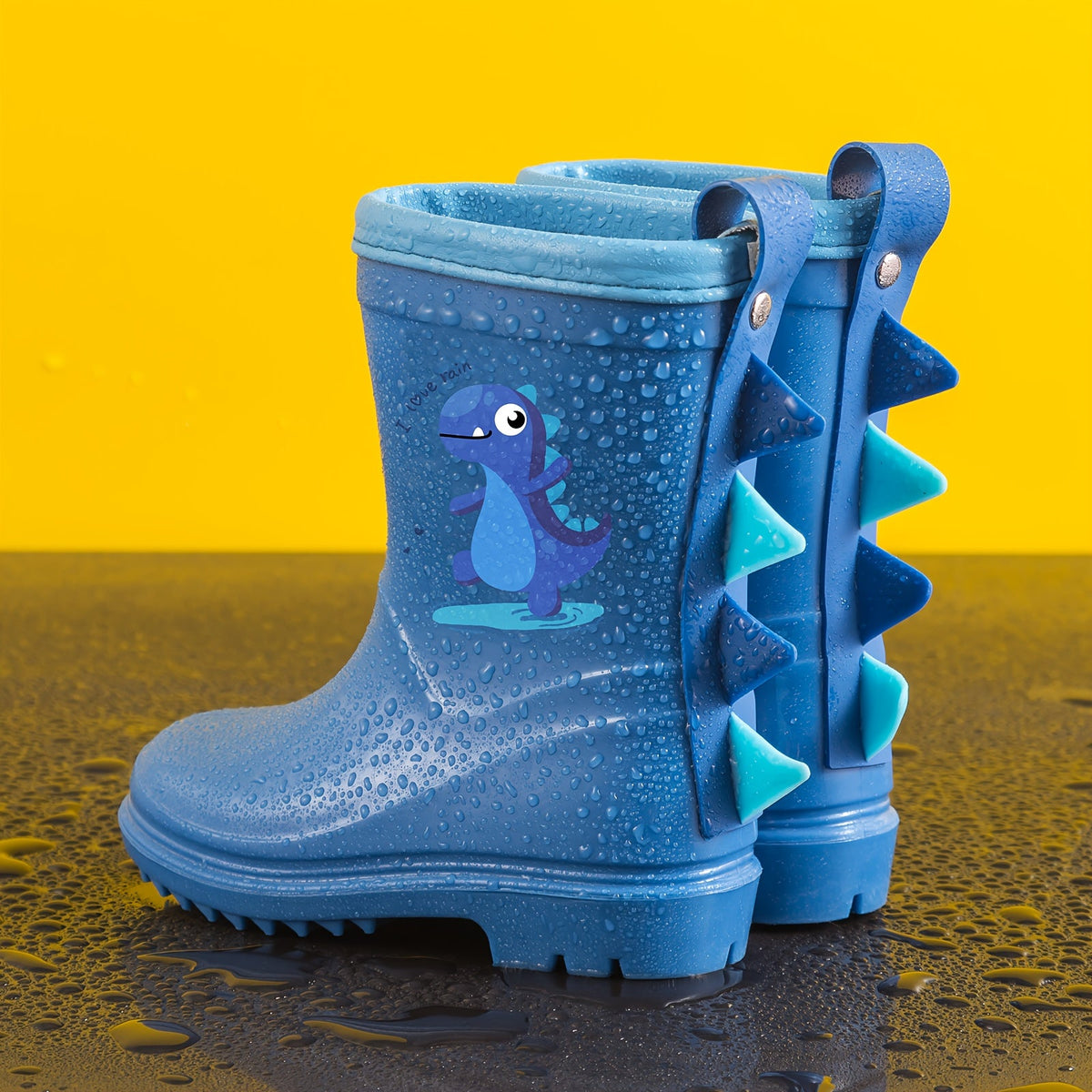 Regenlaarsjes kinderen met dinomotief
