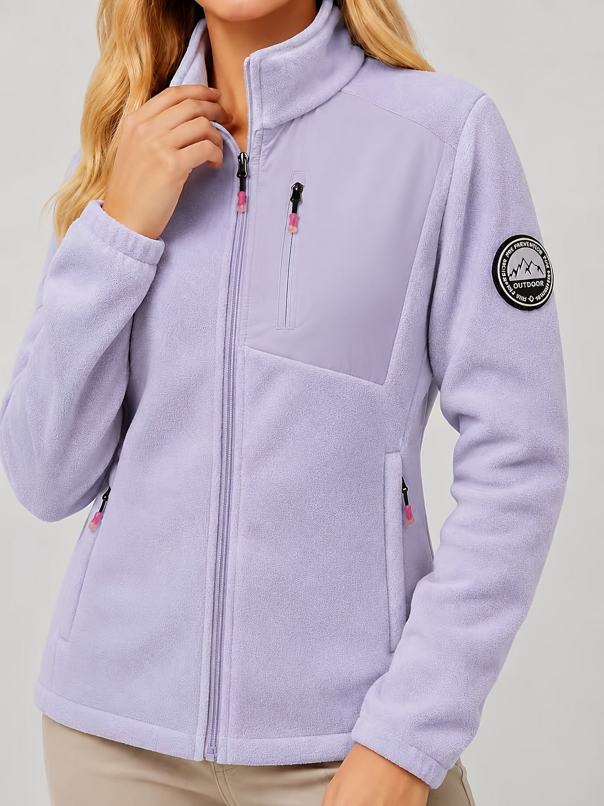 Dames fleece jas met opstaande kraag en drie ritszakken