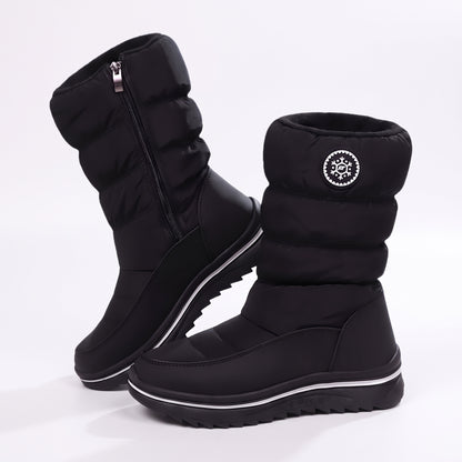 Snowboots dames zwart met doorgestikte schacht en rits aan de zijkant, paar op wit